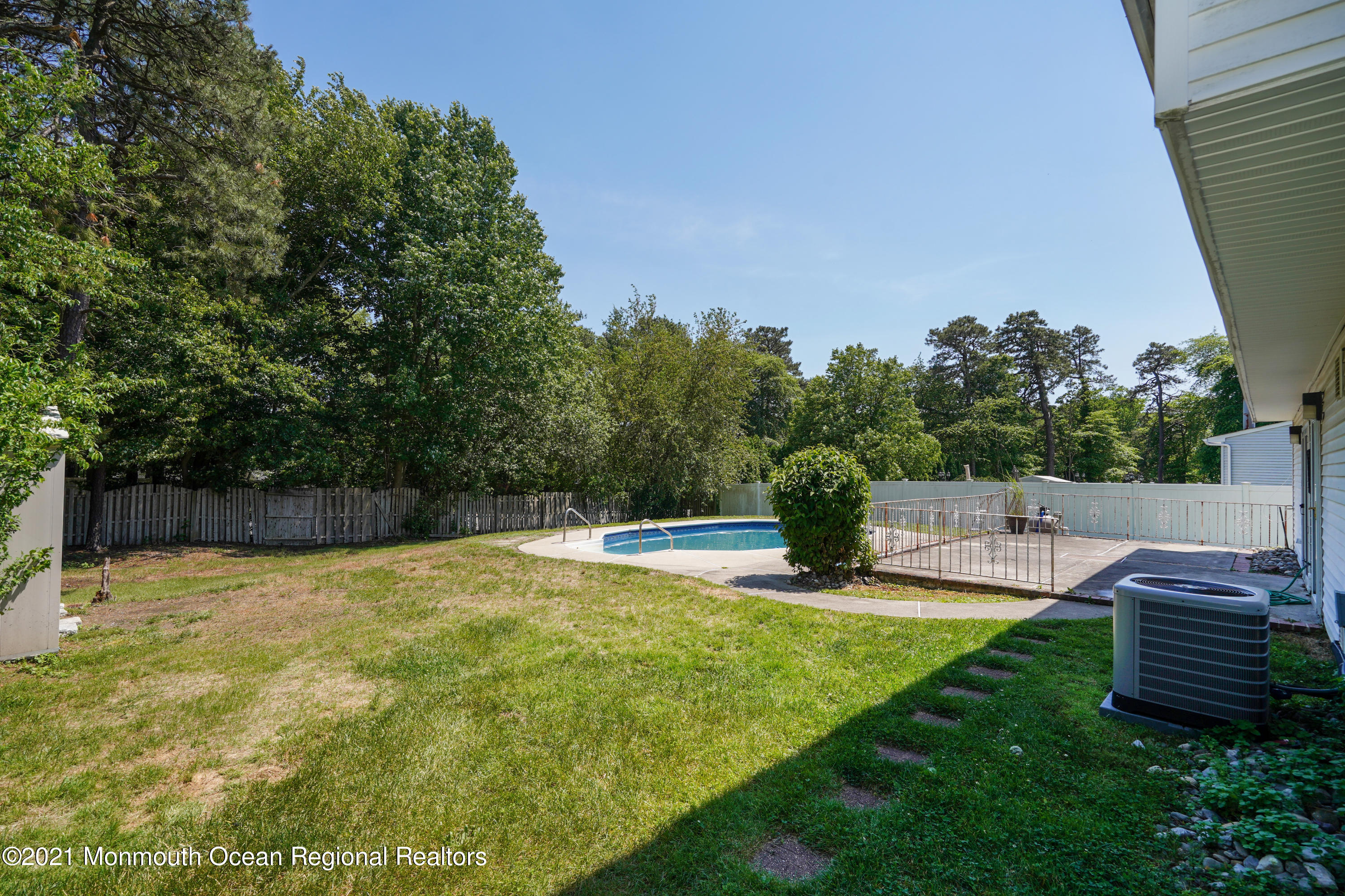 52 Danbury Road Tinton Falls, NJ 07753 - Photo 44 of 50 a view of a swimming pool with a patio