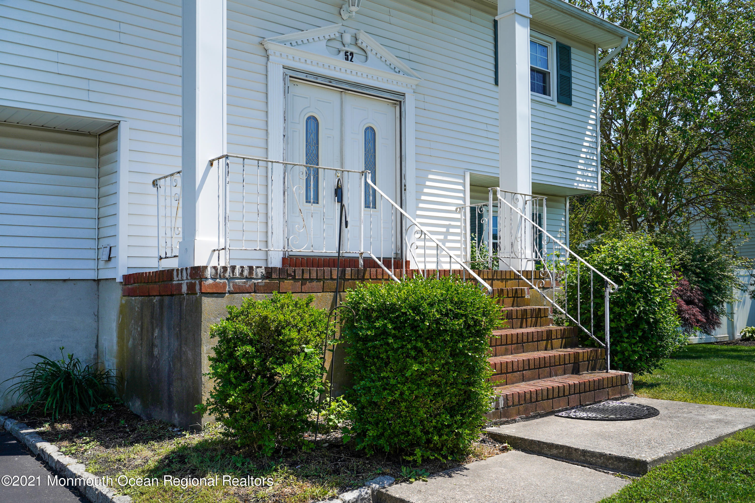 52 Danbury Road Tinton Falls, NJ 07753 - Photo 47 of 50 a front view of a house with a yard