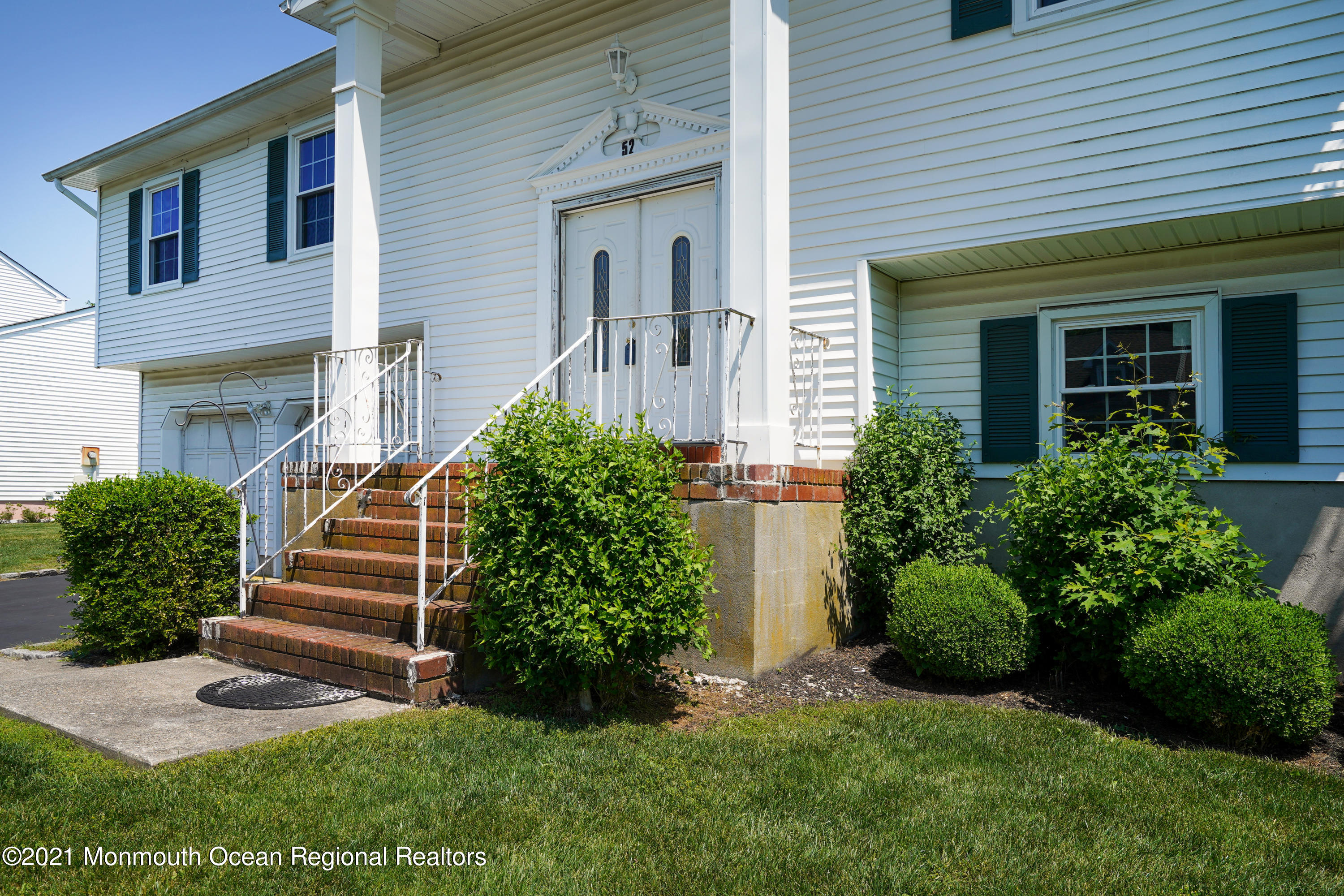 52 Danbury Road Tinton Falls, NJ 07753 - Photo 48 of 50 a front view of a house with a yard