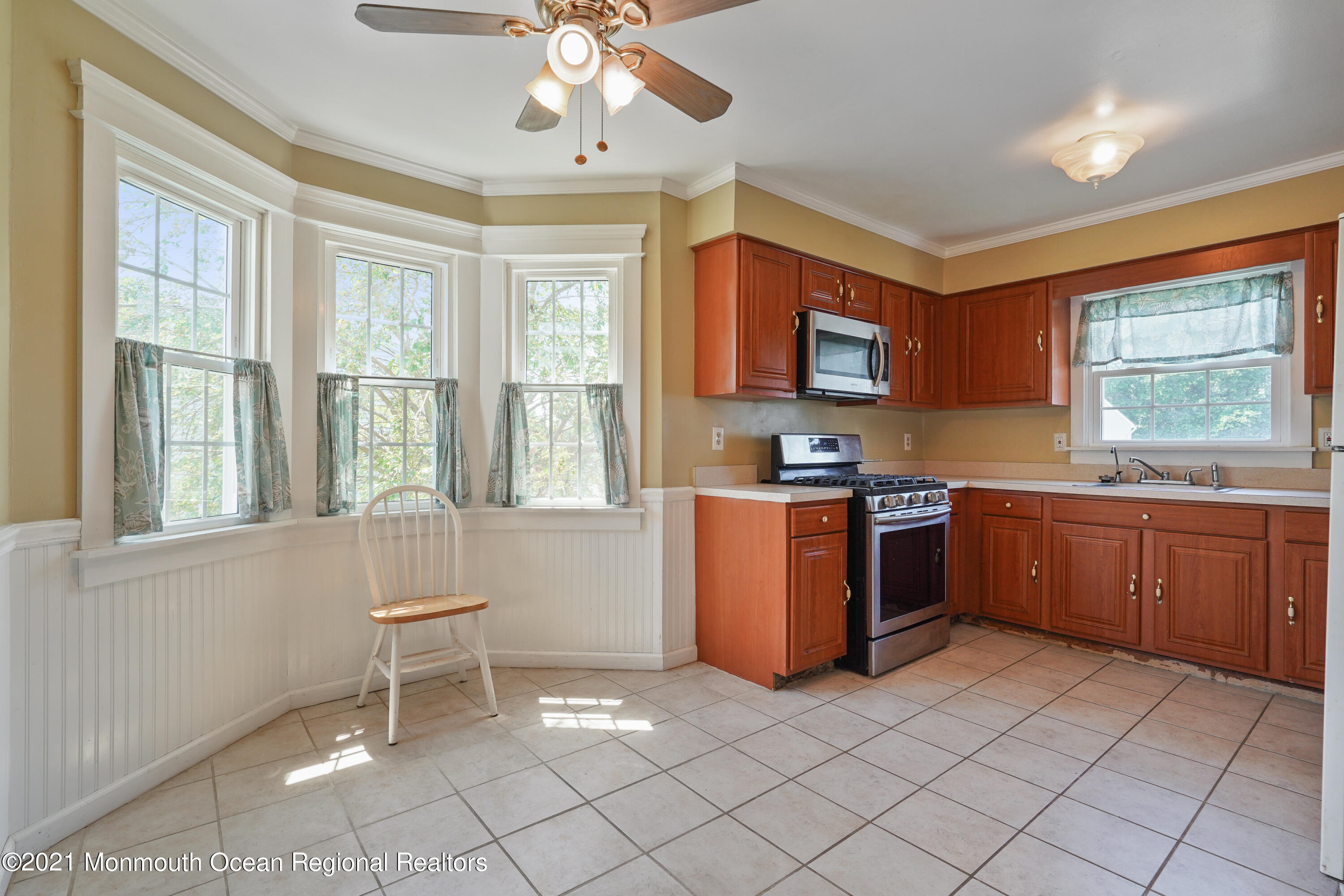 52 Danbury Road Tinton Falls, NJ 07753 - Photo 8 of 50 a kitchen with granite countertop a stove a sink dishwasher and a refrigerator