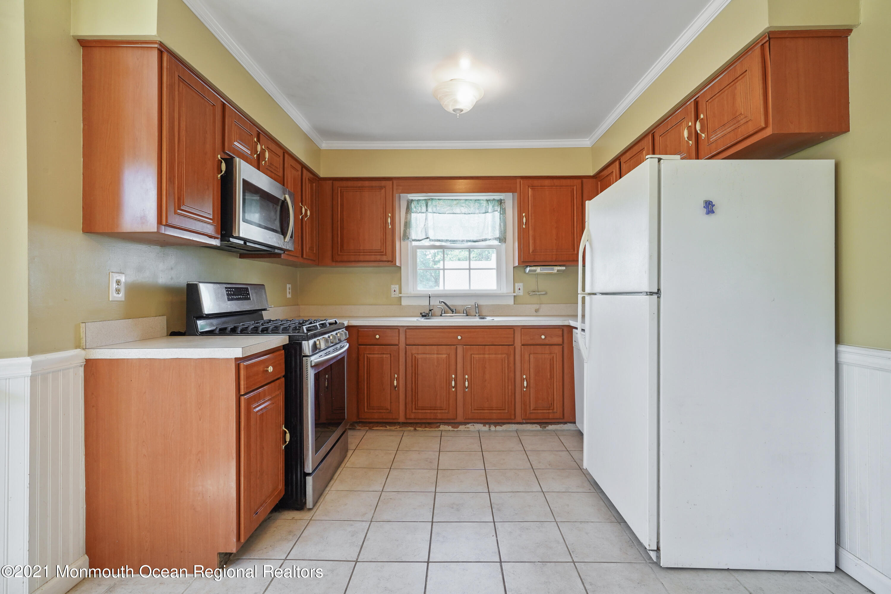 52 Danbury Road Tinton Falls, NJ 07753 - Photo 9 of 50 a kitchen with stainless steel appliances granite countertop a refrigerator sink and cabinets