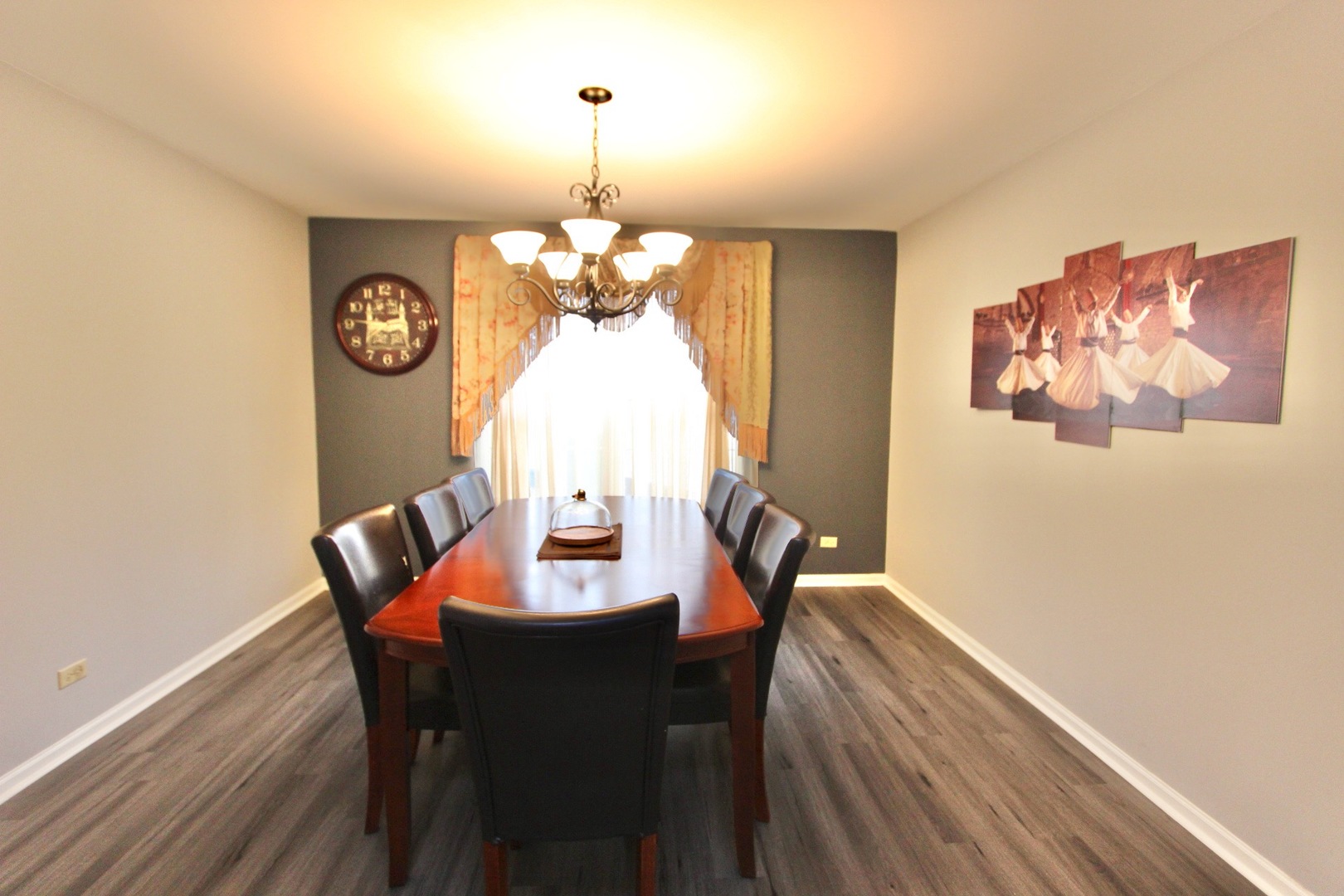 1458 Wildmeadow Road Round Lake, IL 60073 - Photo 16 of 45 a view of a dining room with furniture a chandelier and wooden floor