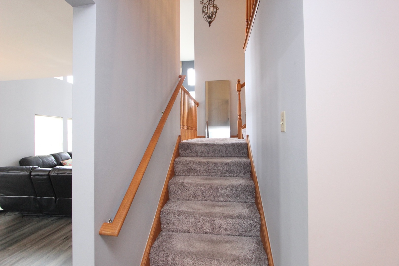 1458 Wildmeadow Road Round Lake, IL 60073 - Photo 17 of 45 a view of a hallway to a livingroom with stairs