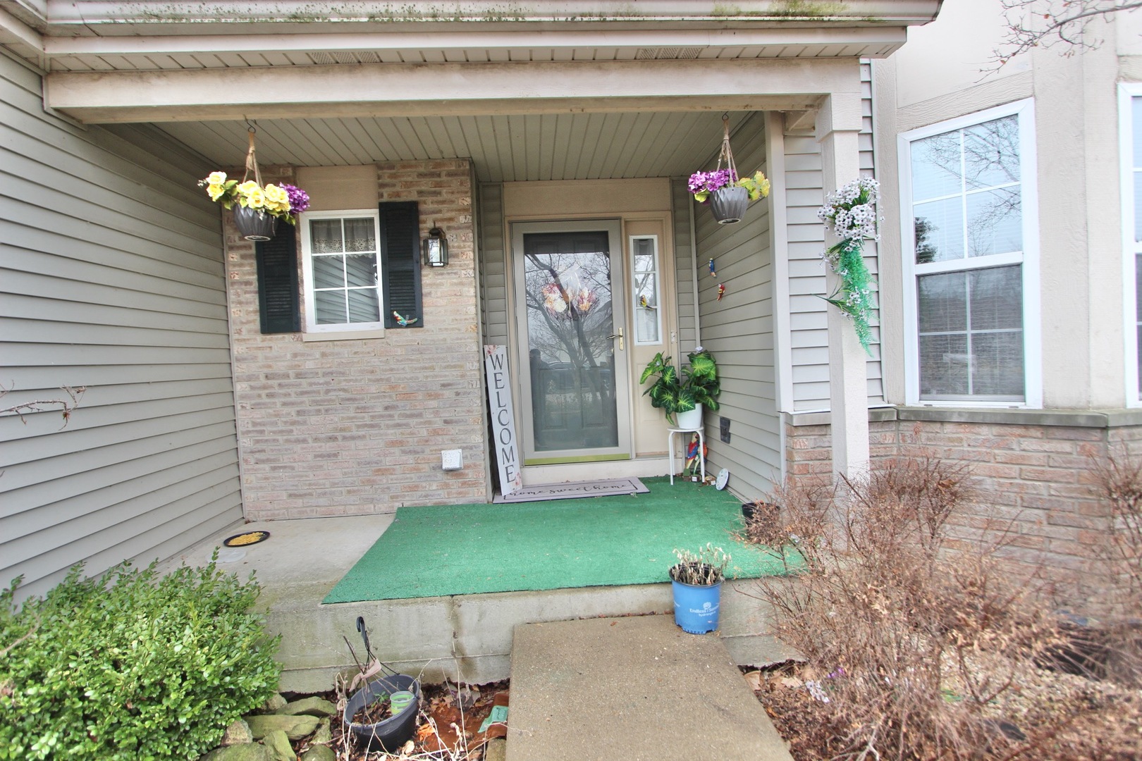 1458 Wildmeadow Road Round Lake, IL 60073 - Photo 2 of 45 a front view of a house with patio