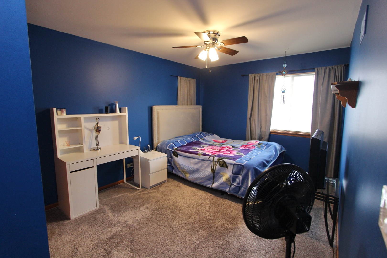 1458 Wildmeadow Road Round Lake, IL 60073 - Photo 24 of 45 a bedroom with a bed and a chandelier