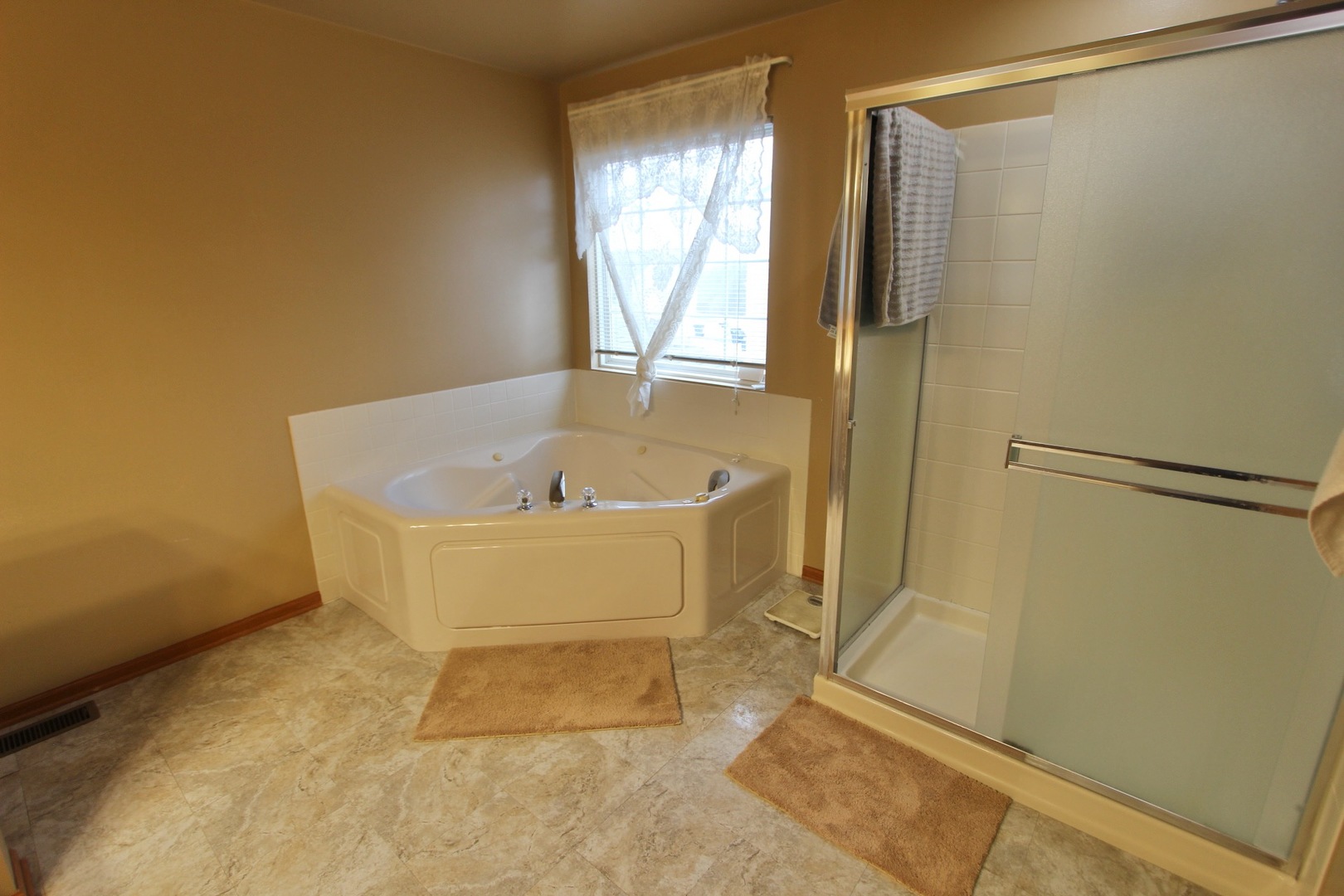 1458 Wildmeadow Road Round Lake, IL 60073 - Photo 32 of 45 a white bath tub sitting next to a window