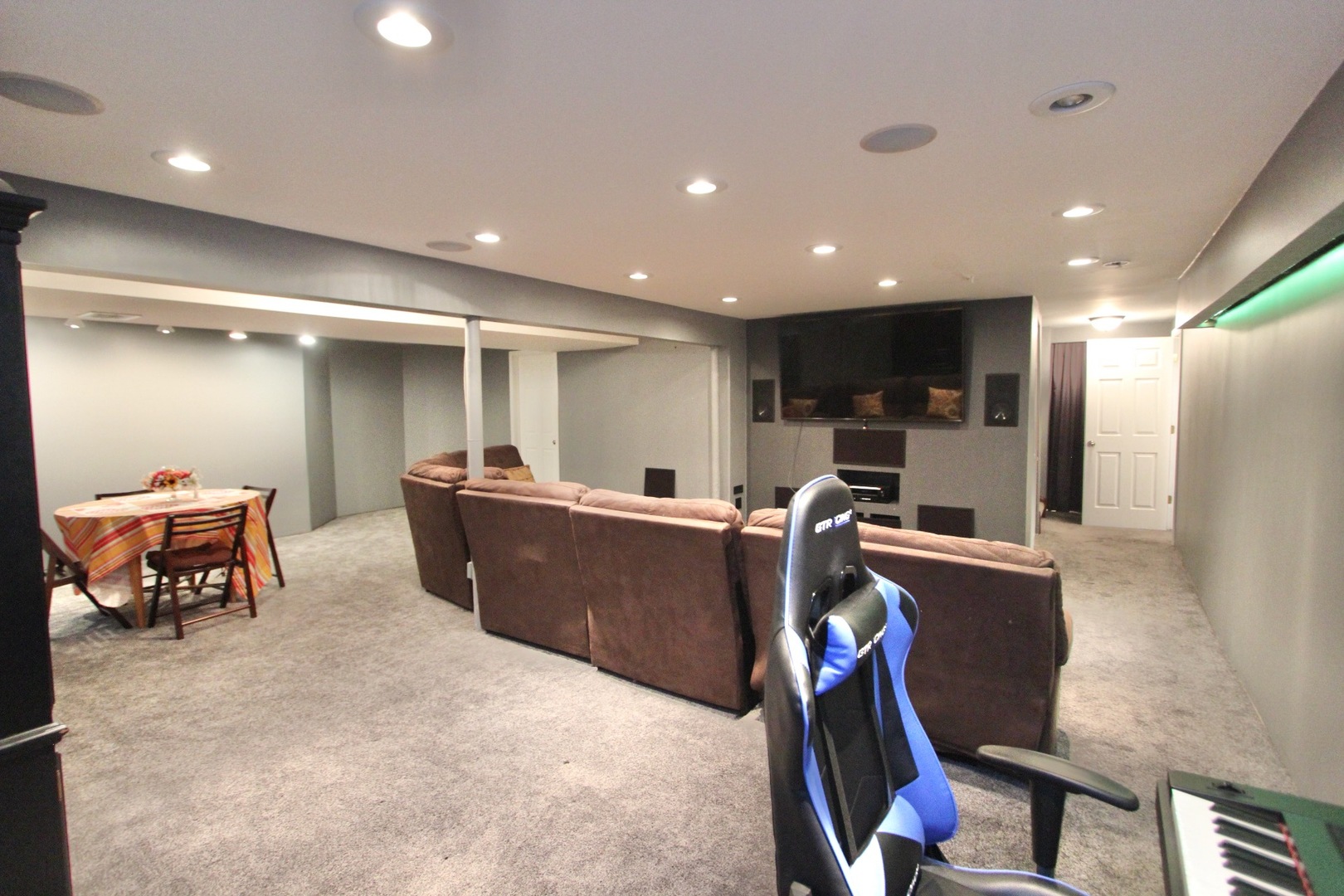 1458 Wildmeadow Road Round Lake, IL 60073 - Photo 37 of 45 a living room with furniture a pool table and a flat screen tv