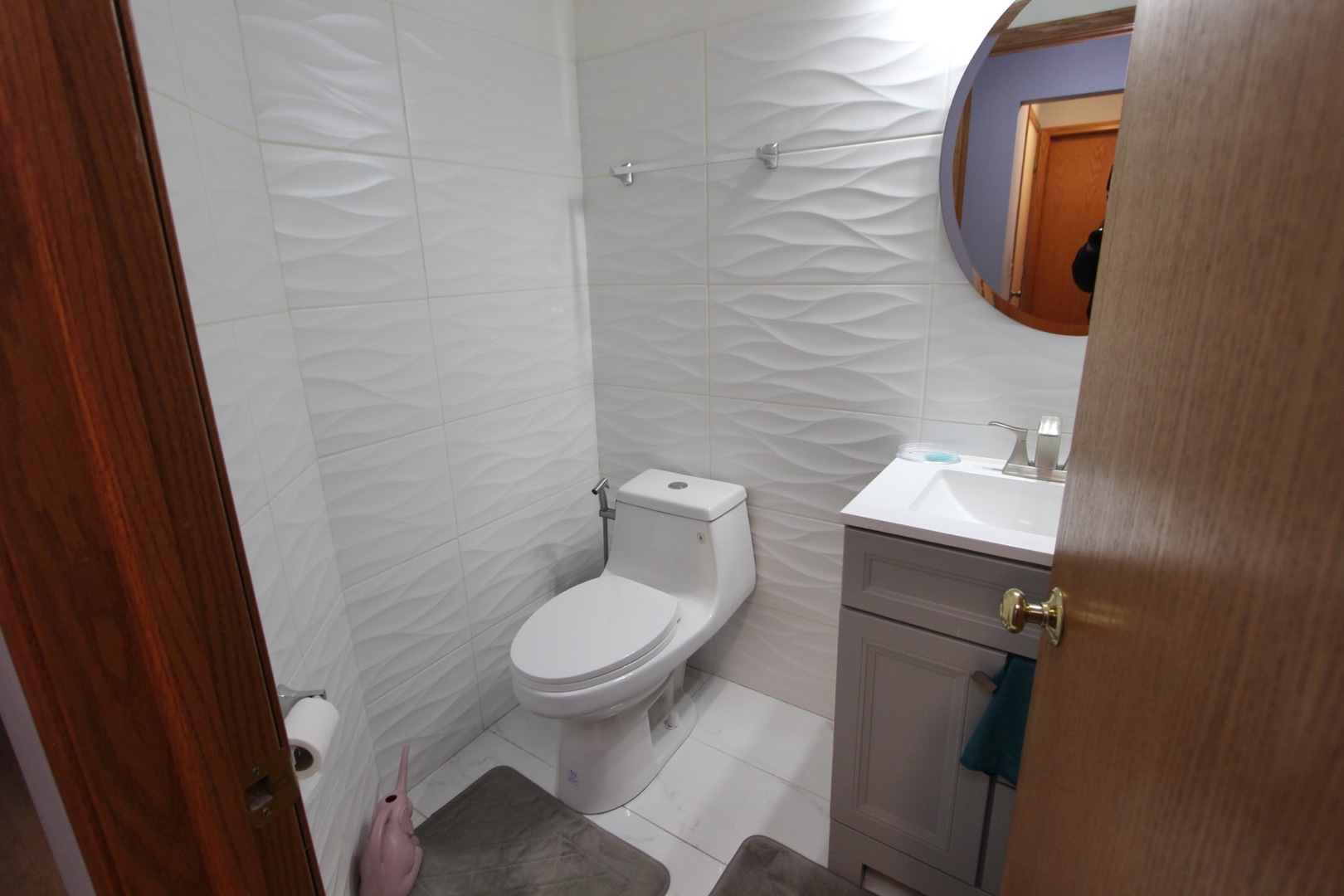 1458 Wildmeadow Road Round Lake, IL 60073 - Photo 43 of 45 a bathroom with a toilet and a mirror