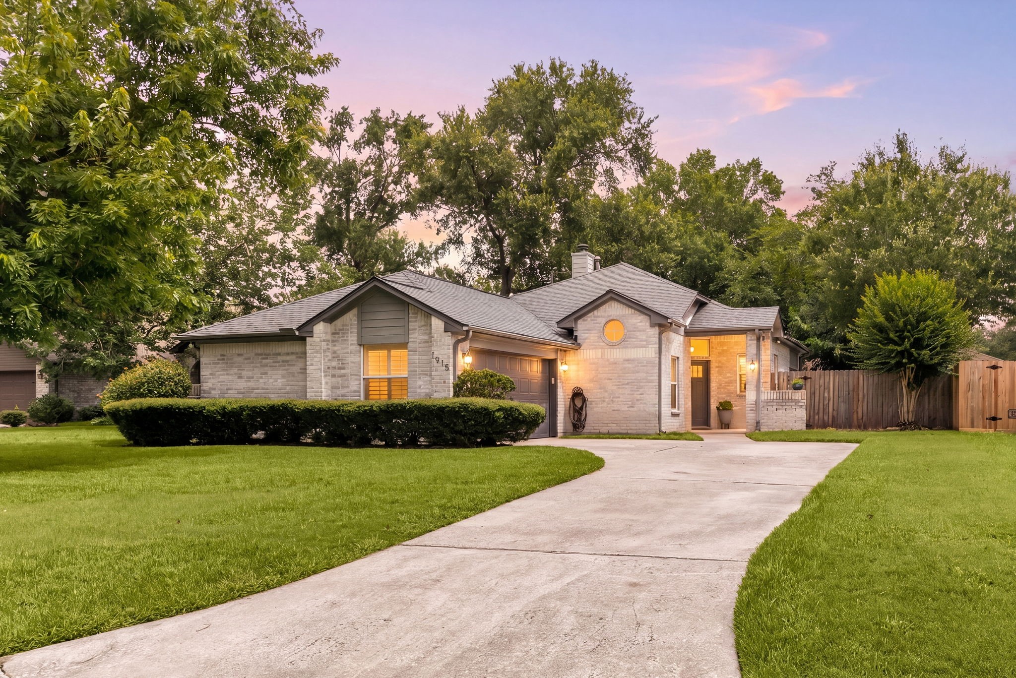 1915 Mercoal Drive Spring, TX 77386 - Photo 1 of 50 Charming curb appeal with a long driveway, mature shade trees, and a welcoming front entry.