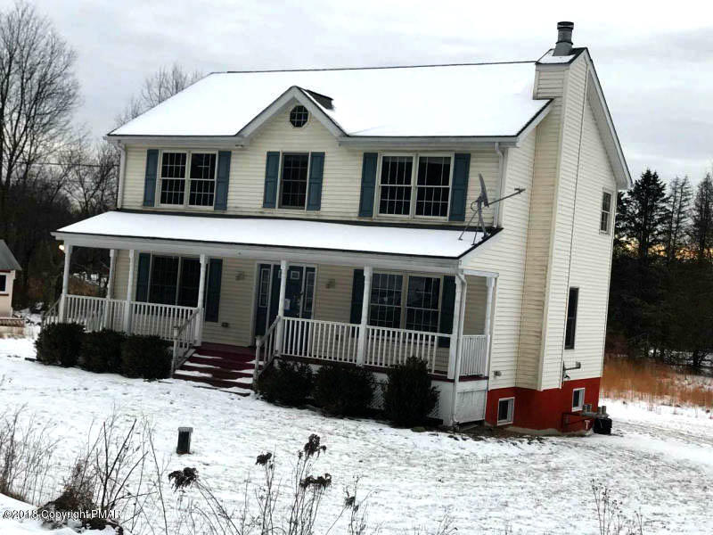 592 Cold Springs Road East Stroudsburg, PA 18302 - Photo 1 of 12 a front view of a house with a yard