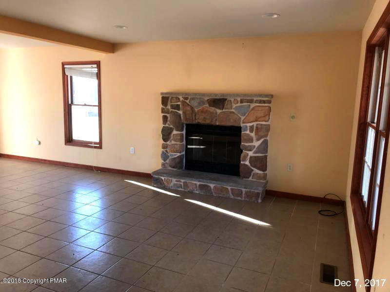 592 Cold Springs Road East Stroudsburg, PA 18302 - Photo 3 of 12 an empty room with windows