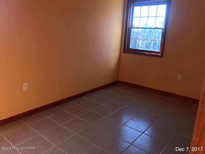 592 Cold Springs Road East Stroudsburg, PA 18302 - Photo 7 of 12 an empty room with windows