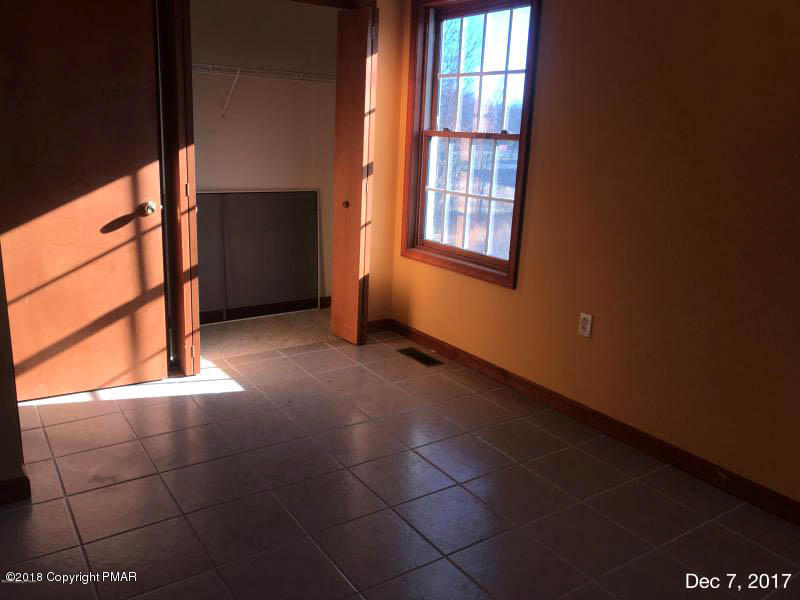 592 Cold Springs Road East Stroudsburg, PA 18302 - Photo 8 of 12 a view of an empty room with a window