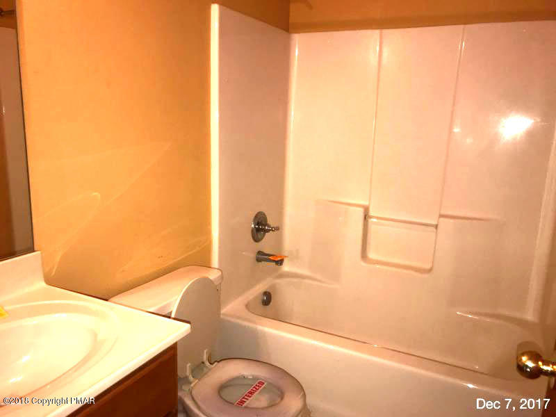 592 Cold Springs Road East Stroudsburg, PA 18302 - Photo 9 of 12 a bathroom with a bathtub and a shower