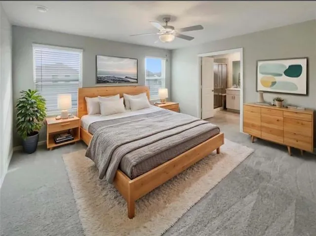 a spacious bedroom with a bed and a dresser