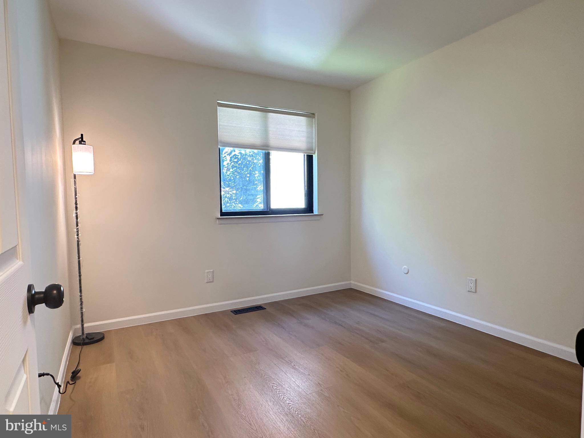 3 Centennial Road Telford, PA 18969 - Photo 13 of 25 an empty room with wooden floor and window