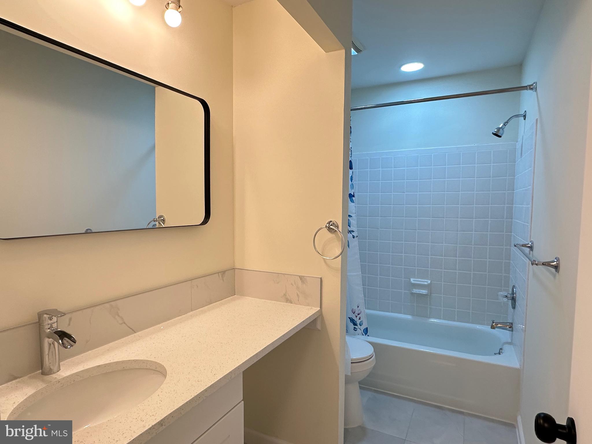 3 Centennial Road Telford, PA 18969 - Photo 16 of 25 a bathroom with a bathtub and a sink