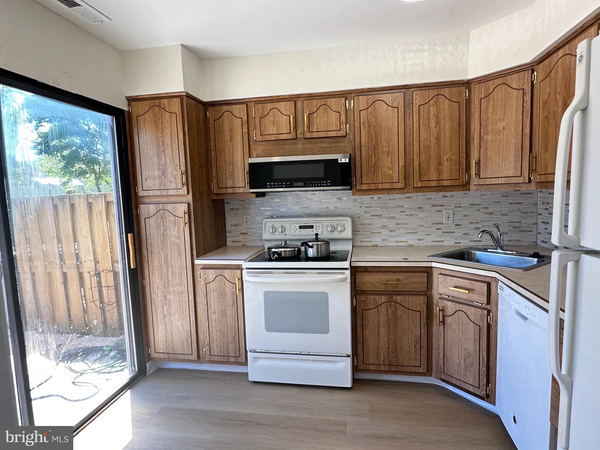 3 Centennial Road Telford, PA 18969 - Photo 4 of 25 a kitchen with stainless steel appliances granite countertop a stove a sink and a refrigerator