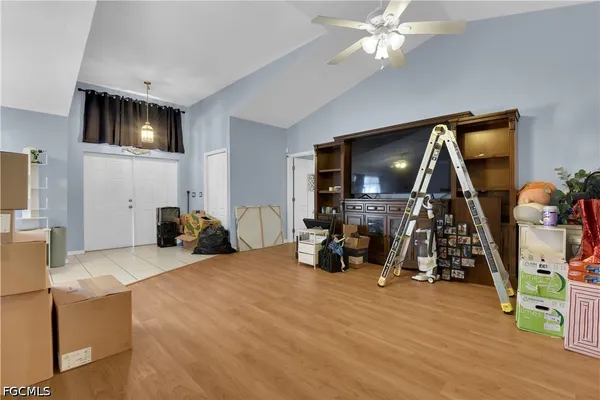 a view of a livingroom with furniture and a flat screen tv