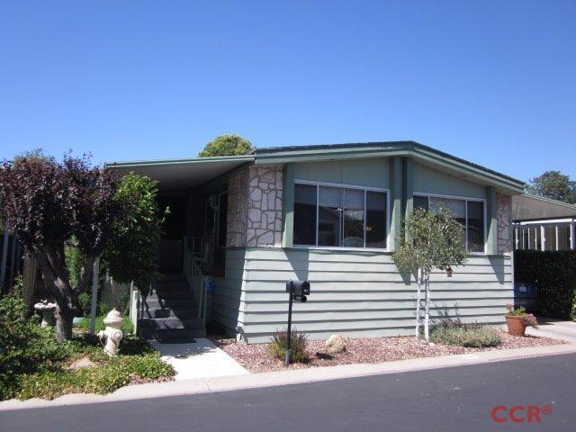 a view of a house with a small yard