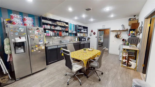 a view of a livingroom with workspace and a window