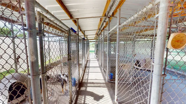 a view of a workspace with furniture and window