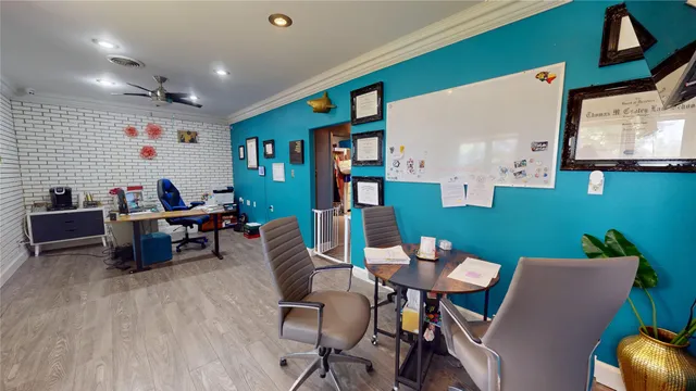 a view of a livingroom with furniture and a flat screen tv