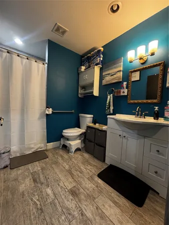 a bedroom with furniture and a chair