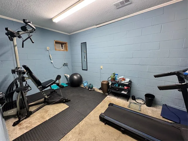 a bedroom with bed and a chandelier