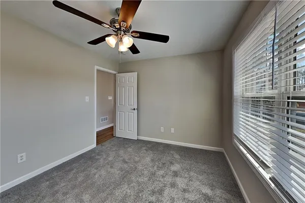 a view of an empty room with a window