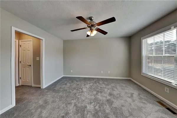 a view of an empty room with a window
