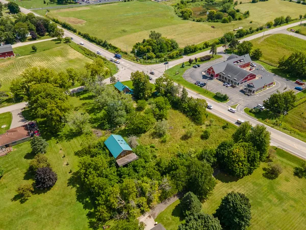 an aerial view of residential houses with outdoor space
