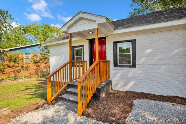 a view of a house with wooden stairs