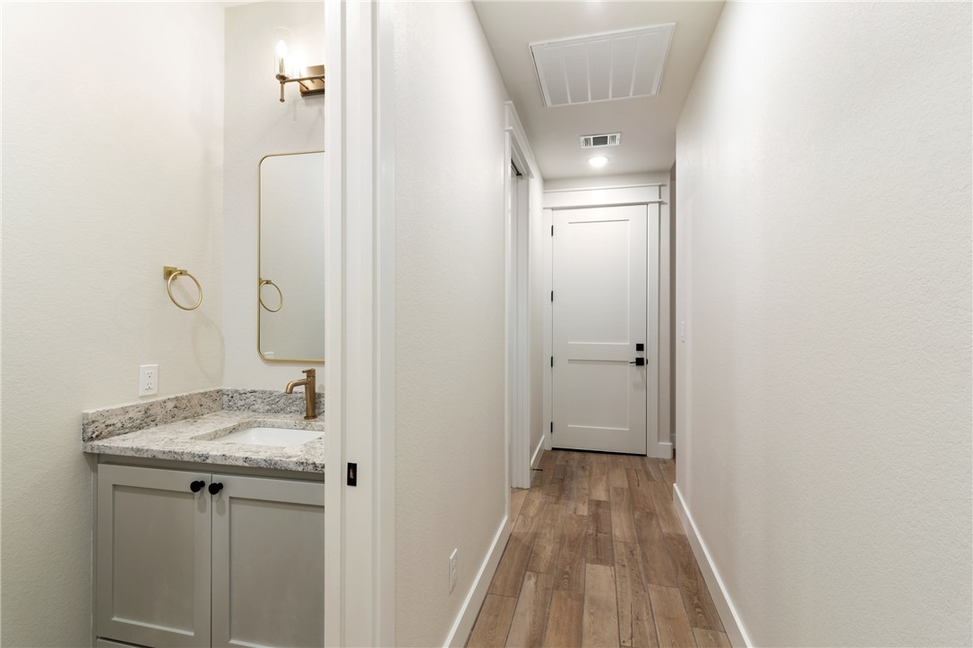 7822 Mathis Crk Drive Bryan, TX 77808 - Photo 36 of 43 a view of a bathroom from a hallway