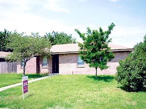 4618 South Georgia Street Amarillo, TX 79110 - Photo 1 of 1 a house that has a tree in front of it