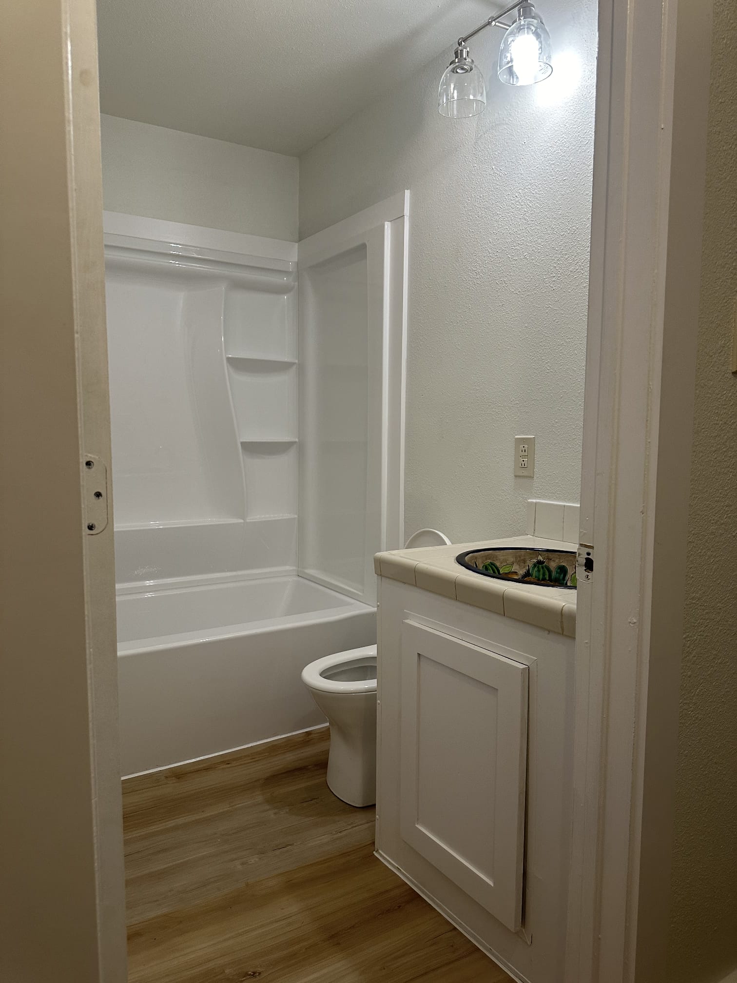 176 Old Lexington Road, Unit C Elgin, TX 78621 - Photo 30 of 31 a bathroom with a sink a toilet and shower