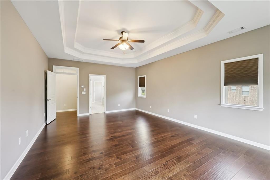 3328 Knight Road Marietta, GA 30066 - Photo 14 of 44 a view of an empty room with wooden floor and a window