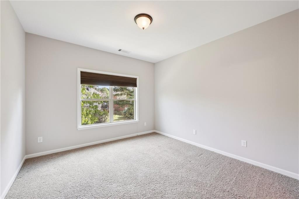 3328 Knight Road Marietta, GA 30066 - Photo 17 of 44 an empty room with windows
