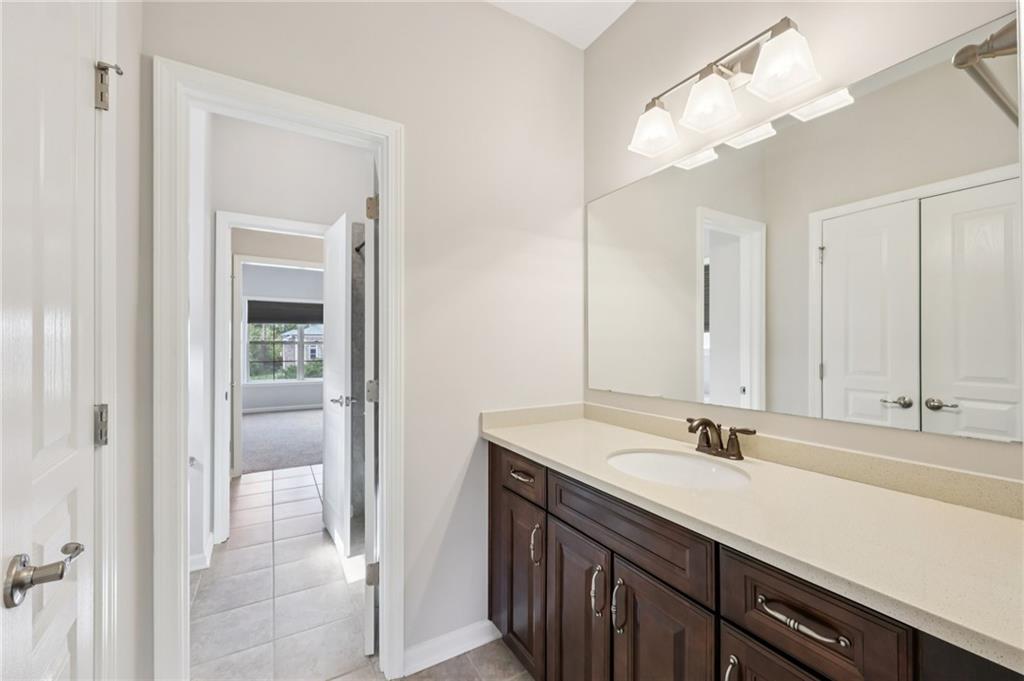 3328 Knight Road Marietta, GA 30066 - Photo 18 of 44 a bathroom with a sink double vanity and a mirror