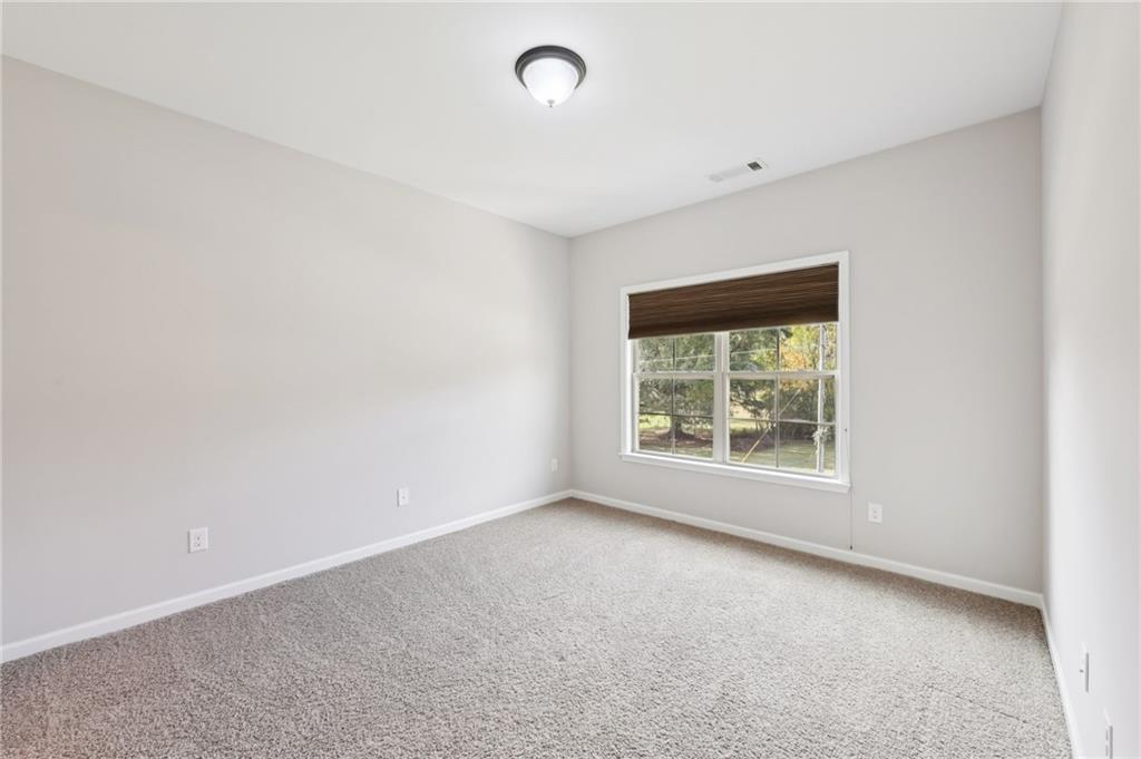 3328 Knight Road Marietta, GA 30066 - Photo 19 of 44 an empty room with a window
