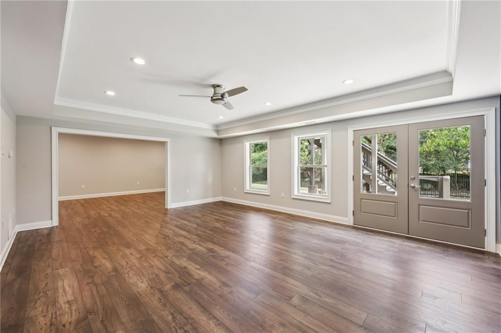 3328 Knight Road Marietta, GA 30066 - Photo 22 of 44 a view of an empty room with a window and wooden floor