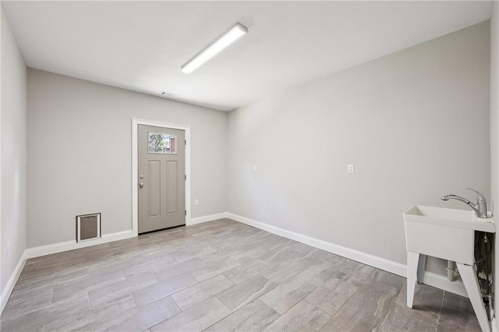 3328 Knight Road Marietta, GA 30066 - Photo 28 of 44 a view of an empty room and wooden floor