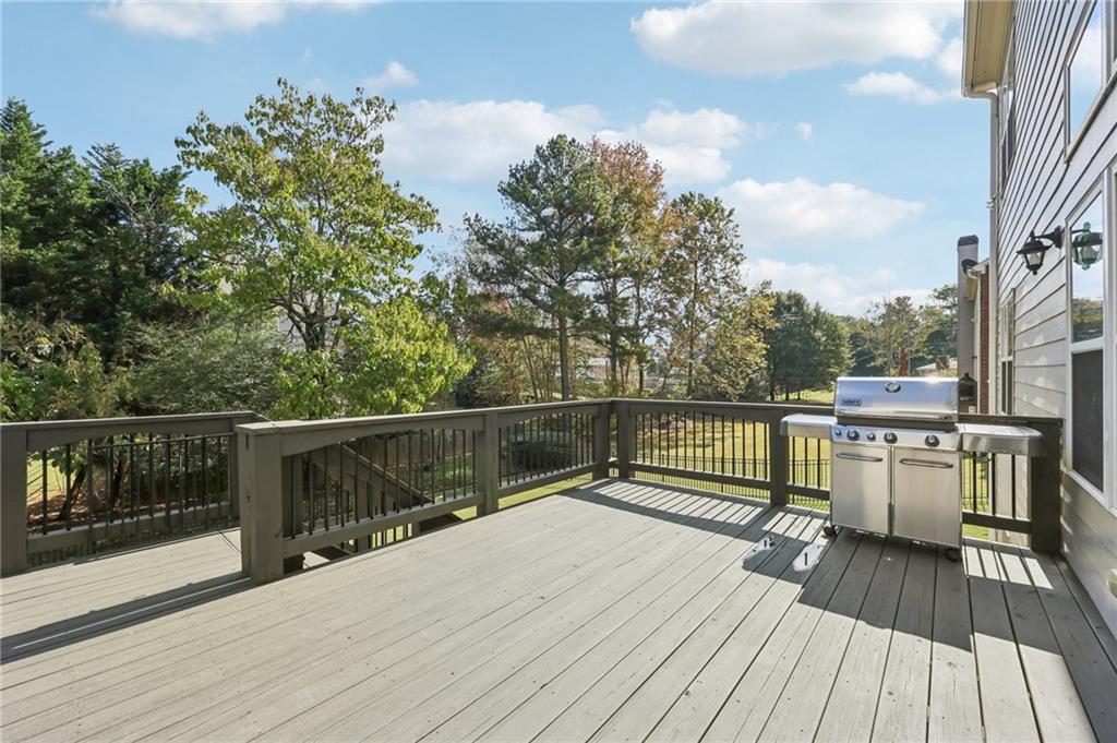 3328 Knight Road Marietta, GA 30066 - Photo 30 of 44 a view of balcony and deck with wooden floor and fence