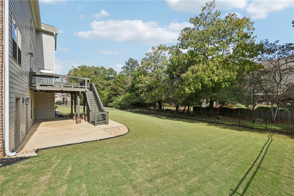 3328 Knight Road Marietta, GA 30066 - Photo 32 of 44 a view of a swimming pool with a yard