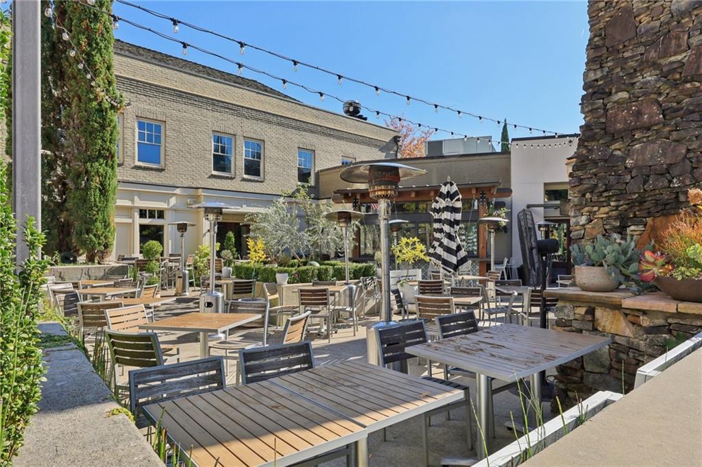 3328 Knight Road Marietta, GA 30066 - Photo 42 of 44 a view of a patio with table and chairs and potted plants