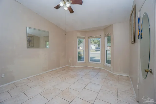 a view of an empty room with a fan