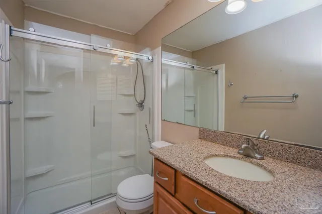 an empty room with chandelier fan