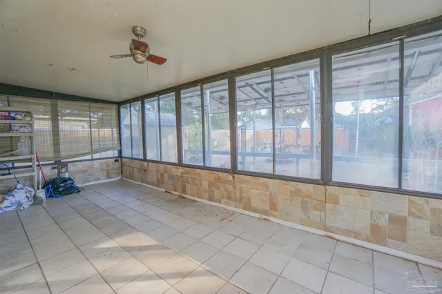 a view of an empty room with a large window