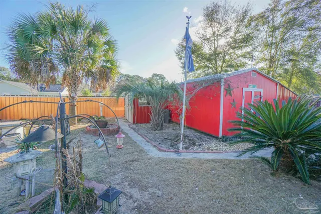 a view of a patio with table and chairs