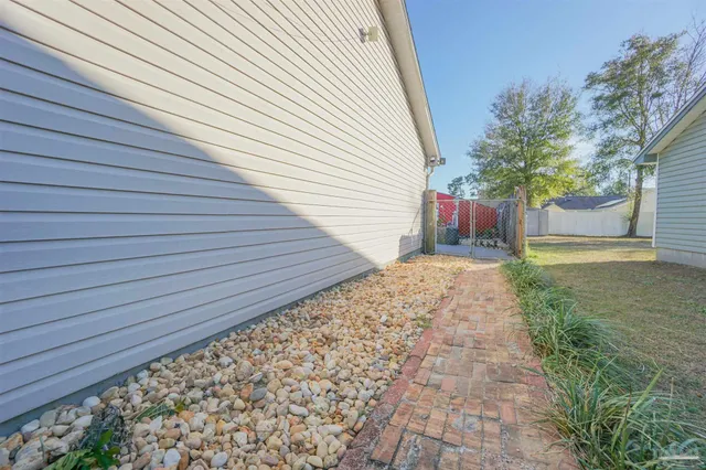 a view of a backyard with pathway